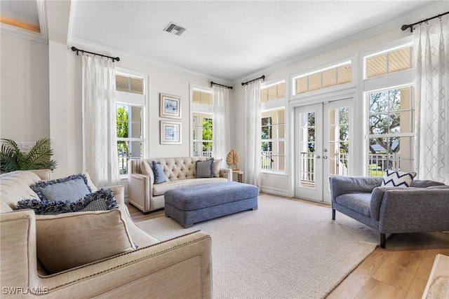 sunroom featuring french doors and visible vents