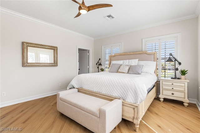 bedroom with light wood-style flooring, multiple windows, and visible vents