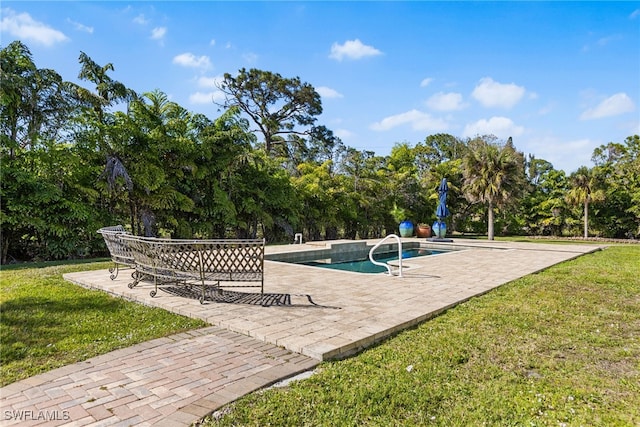 surrounding community featuring a pool, a lawn, and a patio