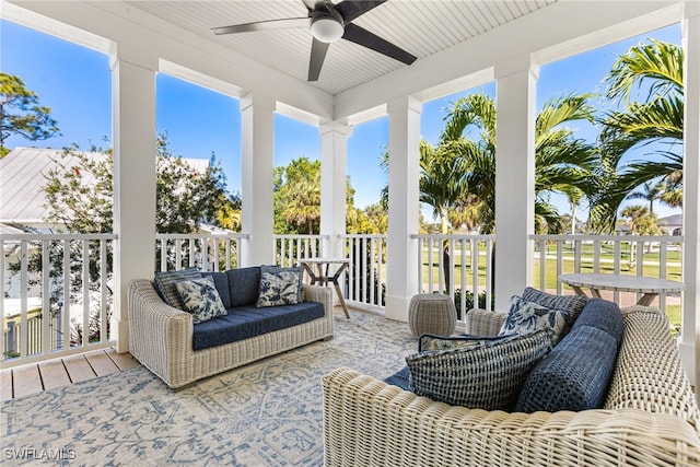 sunroom featuring ceiling fan