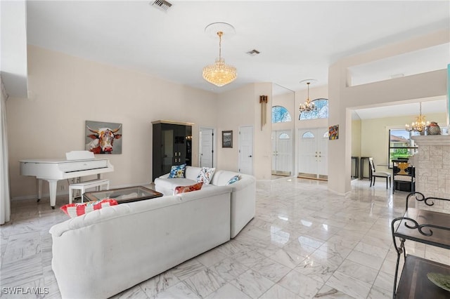 living room featuring an inviting chandelier