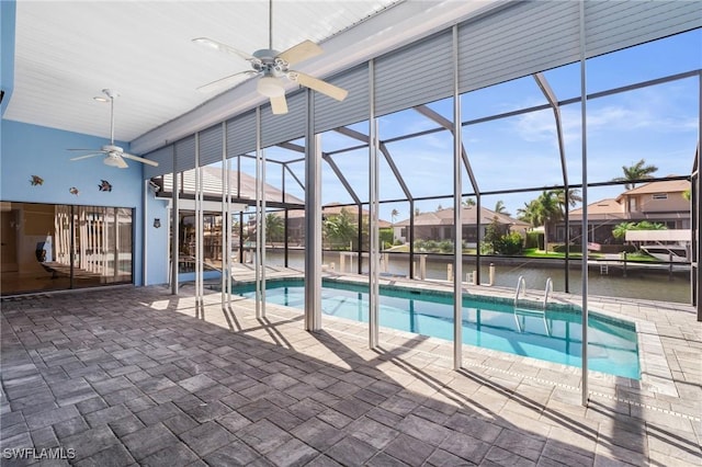 view of pool featuring a lanai, a patio, and ceiling fan