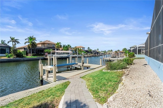 dock area featuring a water view and a lanai