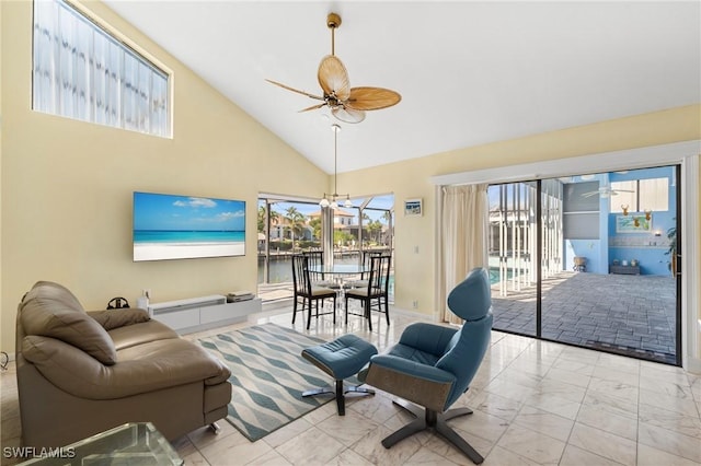 living room featuring ceiling fan and high vaulted ceiling