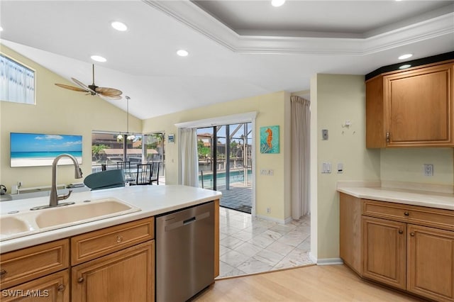 kitchen with lofted ceiling, sink, decorative light fixtures, dishwasher, and ceiling fan