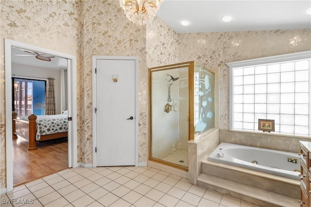 bathroom featuring tile patterned floors, independent shower and bath, and vanity