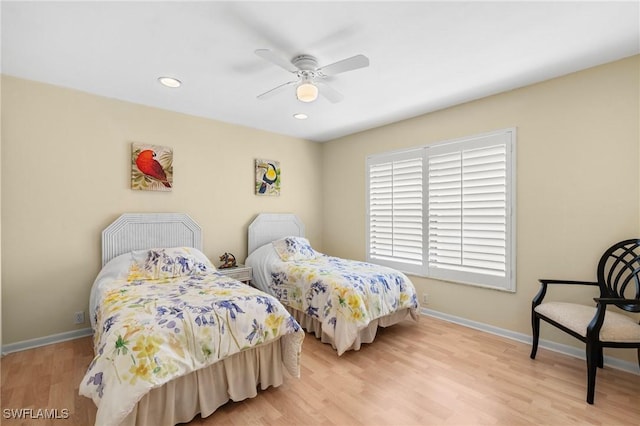 bedroom featuring ceiling fan and light hardwood / wood-style floors