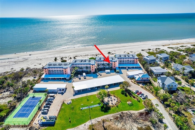 aerial view featuring a water view and a beach view