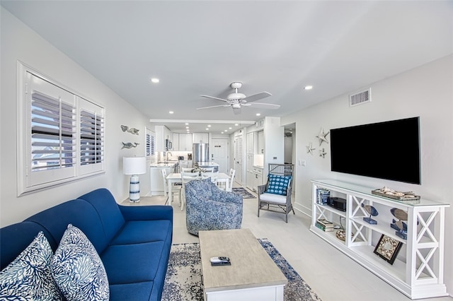 living room with ceiling fan