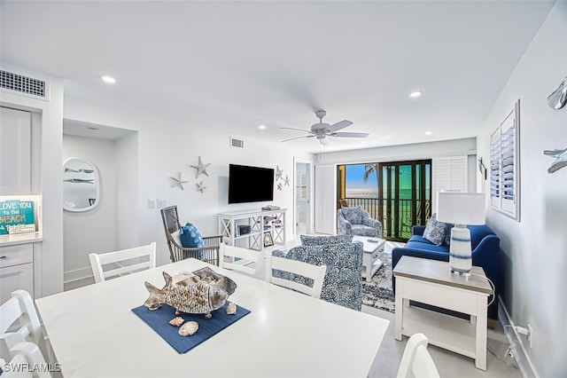 dining space featuring ceiling fan