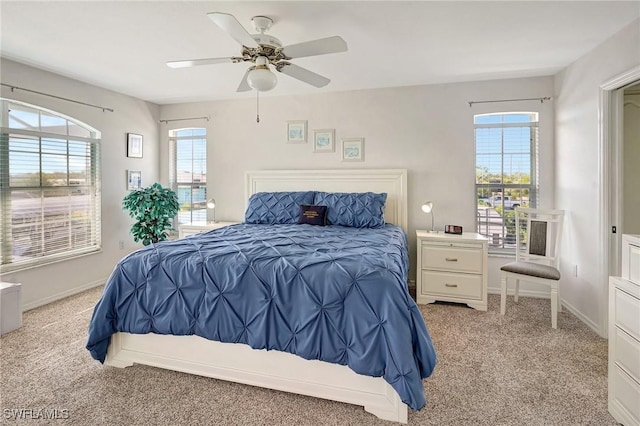 bedroom featuring carpet floors, baseboards, and ceiling fan