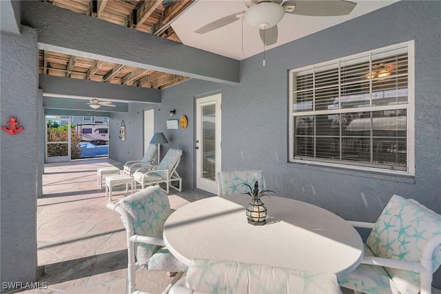 view of patio / terrace with outdoor dining space and a ceiling fan