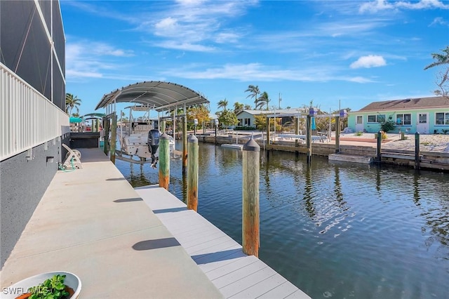 dock area with a water view, a residential view, boat lift, and a lanai