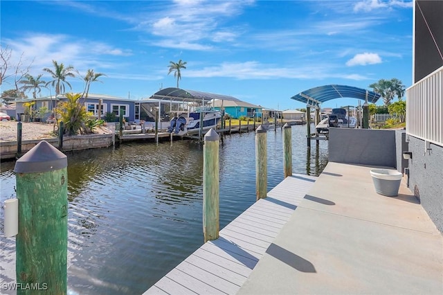 dock area with a residential view and a water view