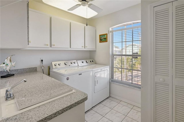 laundry room with separate washer and dryer, a ceiling fan, cabinet space, and a healthy amount of sunlight