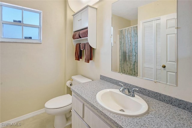 full bathroom with vanity, a shower with curtain, tile patterned flooring, toilet, and baseboards