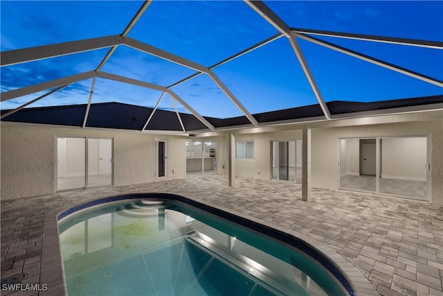 outdoor pool featuring a lanai and a patio