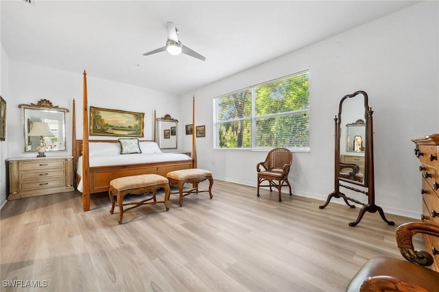 bedroom with ceiling fan and light hardwood / wood-style floors