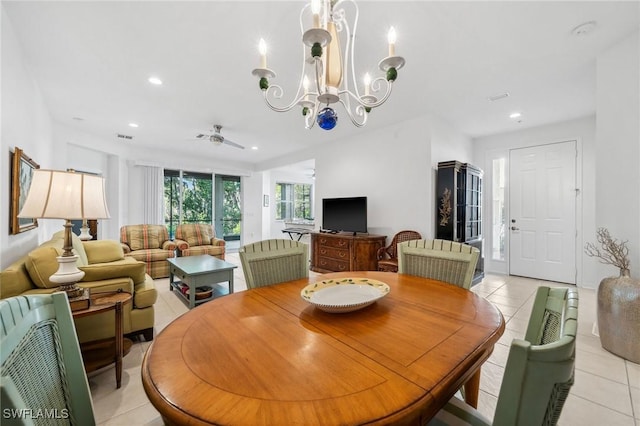 tiled dining room with a notable chandelier