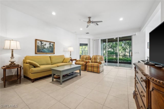 living room featuring light tile patterned floors and ceiling fan