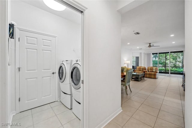 laundry area with separate washer and dryer, light tile patterned floors, and ceiling fan