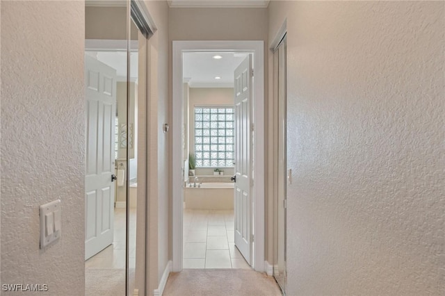 1813 Senegal Date Dr, Naples, FL 34119 - hall with a textured wall, ornamental molding, and tile patterned flooring