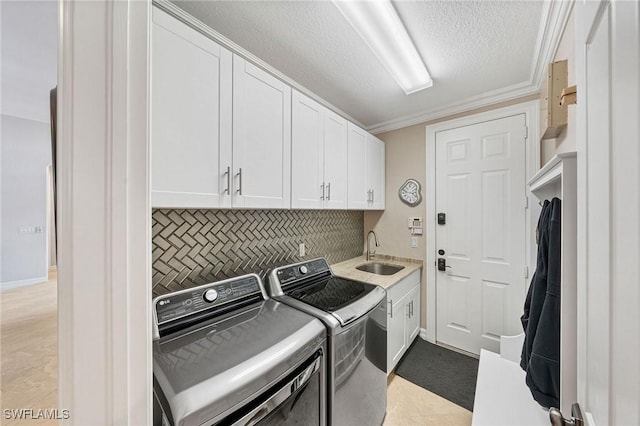 1813 Senegal Date Dr, Naples, FL 34119 - laundry area with washer and dryer, cabinet space, a textured ceiling, and crown molding
