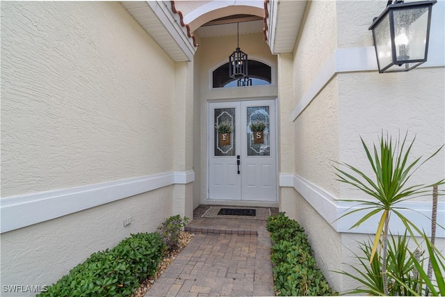 property entrance featuring french doors