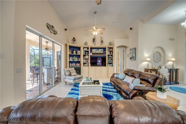 living area featuring a ceiling fan, arched walkways, light tile patterned flooring, and high vaulted ceiling