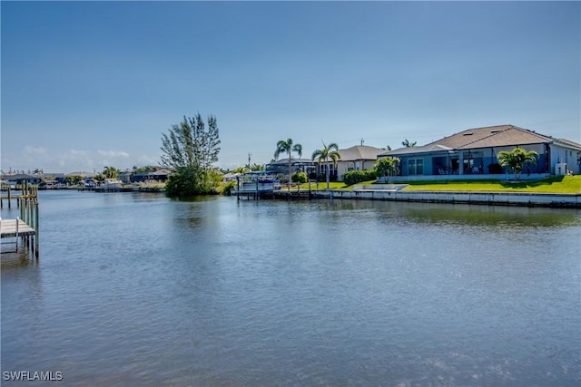 property view of water featuring a boat dock and a residential view