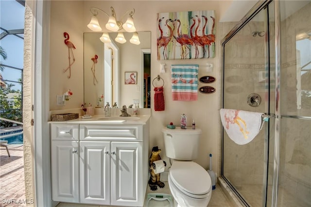 bathroom with toilet, a stall shower, and vanity