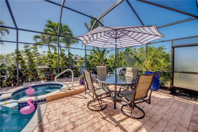 view of patio with glass enclosure, outdoor dining space, and an in ground hot tub