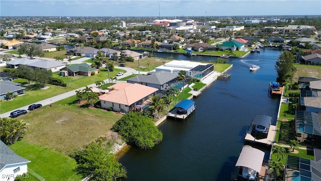 aerial view featuring a water view and a residential view