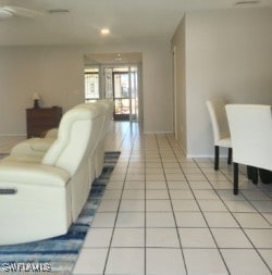 living room with light tile patterned floors, ceiling fan, recessed lighting, and baseboards