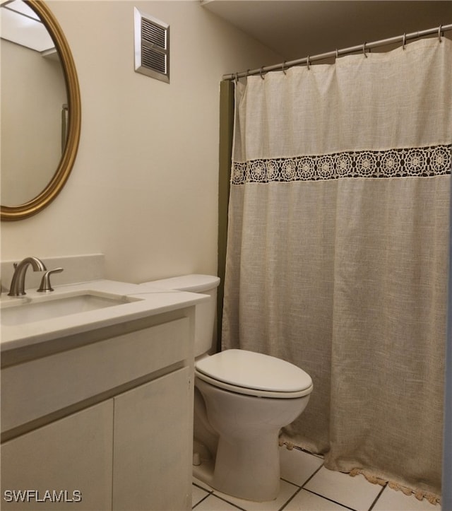 full bathroom with visible vents, toilet, tile patterned floors, curtained shower, and vanity