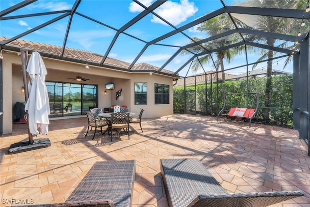 3366 Baltic Dr, Naples, FL 34119 - view of patio / terrace with a ceiling fan, outdoor dining area, and glass enclosure