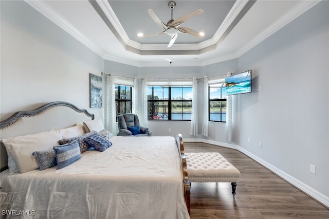 3366 Baltic Dr, Naples, FL 34119 - bedroom with dark wood-type flooring, a raised ceiling, multiple windows, and crown molding