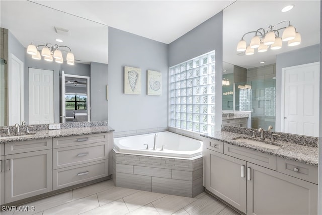 3366 Baltic Dr, Naples, FL 34119 - full bath featuring two vanities, a sink, and a shower stall