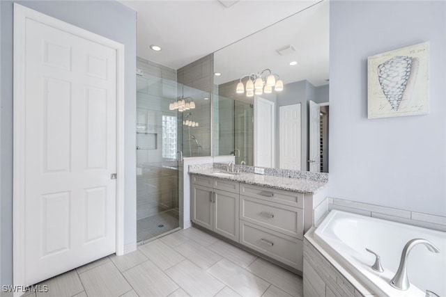 3366 Baltic Dr, Naples, FL 34119 - bathroom with a garden tub, recessed lighting, a notable chandelier, vanity, and a shower stall