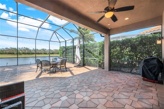 3366 Baltic Dr, Naples, FL 34119 - view of patio / terrace with a ceiling fan, a lanai, a water view, and grilling area
