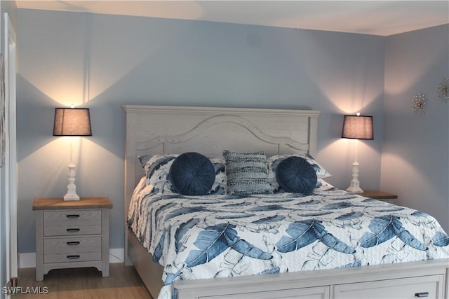 bedroom featuring wood finished floors