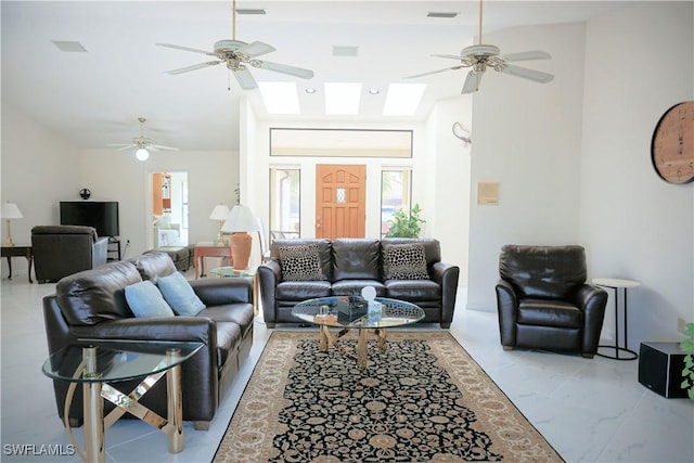 living room featuring marble finish floor, visible vents, and a ceiling fan