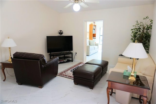 living area with marble finish floor and a ceiling fan