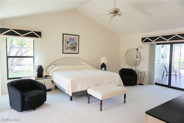 carpeted bedroom featuring access to exterior, lofted ceiling, and ceiling fan