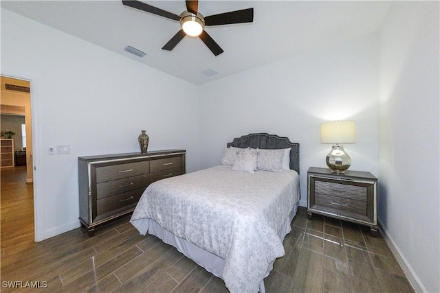 bedroom featuring visible vents, wood finished floors, and baseboards