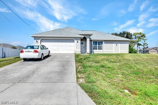 ranch-style house with a garage and a front yard