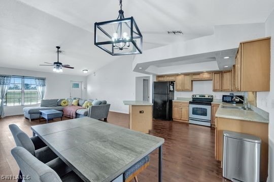 dining room featuring sink, ceiling fan with notable chandelier, and dark hardwood / wood-style floors