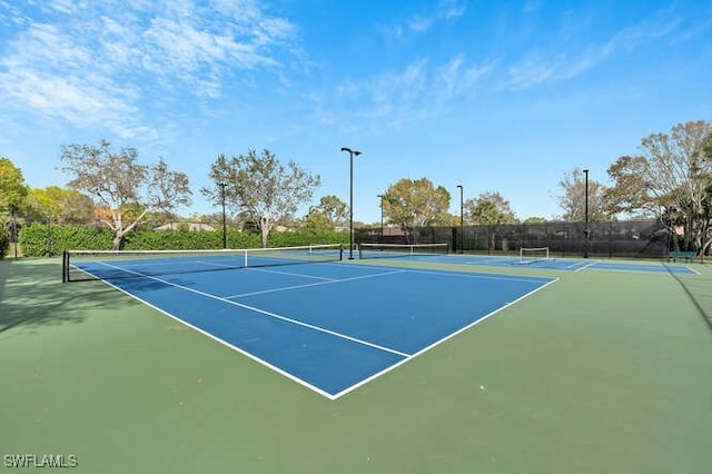 view of sport court with fence