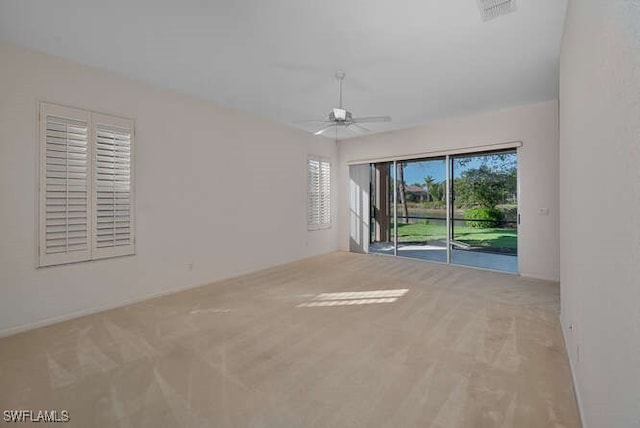 unfurnished room with visible vents, ceiling fan, and carpet floors