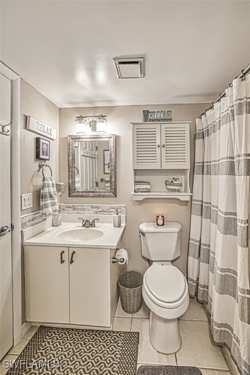 full bathroom featuring visible vents, toilet, vanity, and tile patterned flooring